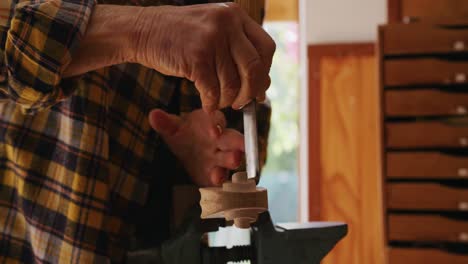 female luthier at work in her workshop