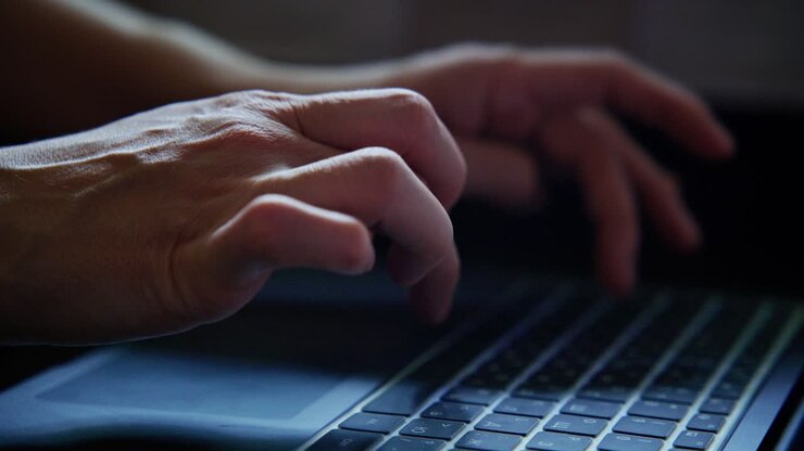 Person Typing on a Laptop