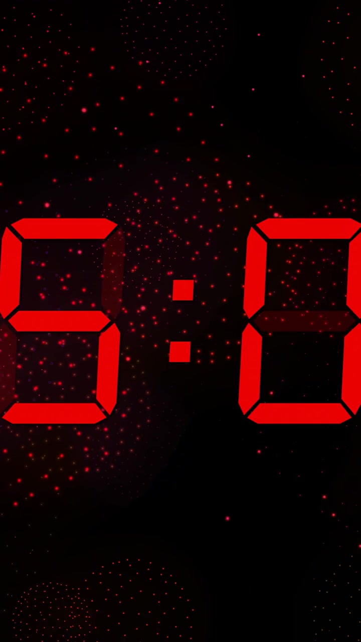 Animation of digital clock counting down to midnight on black background