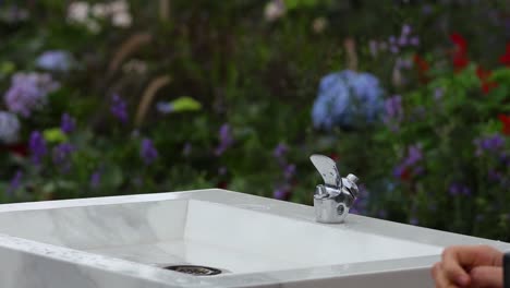 sequence of a hand shutting off a water tap