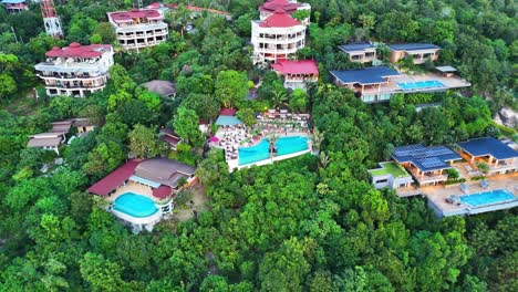 luxury tropical resort surrounded with jungle, aerial drone view