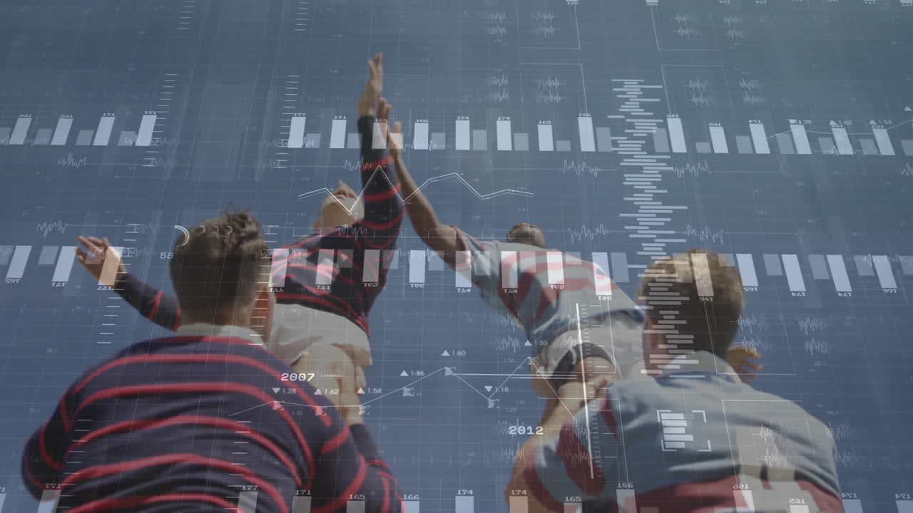 Reaching for rugby ball, players with animation of financial data charts overlay