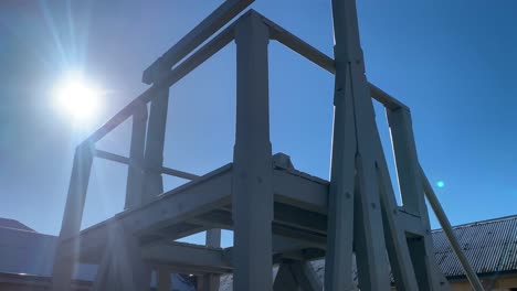 old 1800s gaol gallows close up sun flare handheld