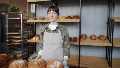 portrait of beautiful caucasian woman at work in bakery