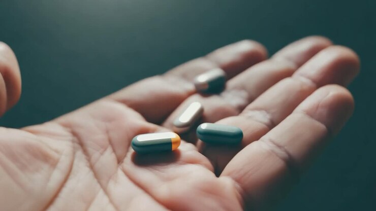 Closeup of pills in a hand