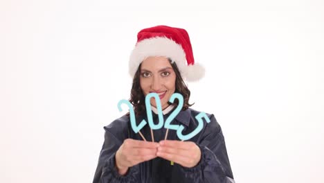 Woman with Santa hat and 2025 sign
