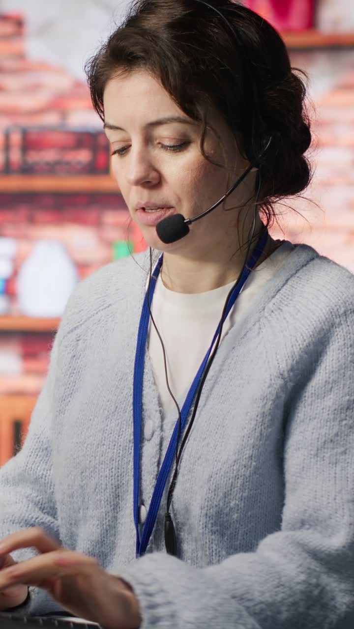 Vertical video Call center employee handling customer complaints, offering helpful solutions
