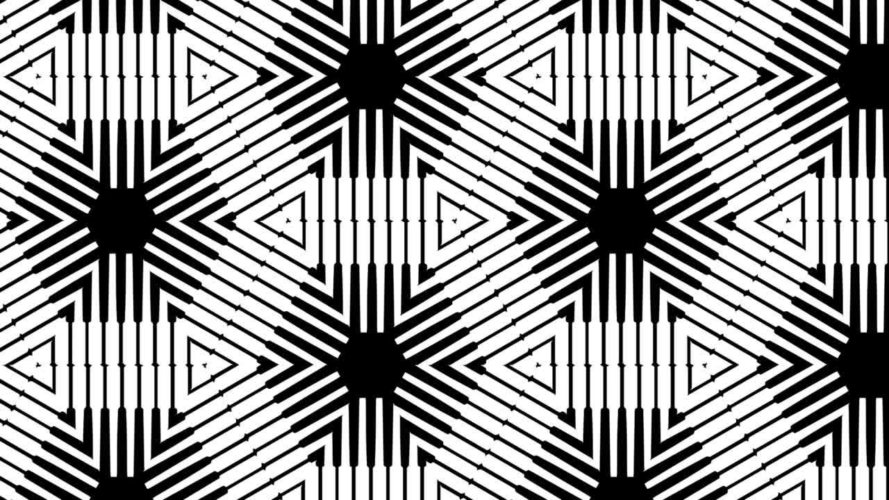 Black And White Symmetrical Designs Transition Over Black Background - Closeup, Slow Motion