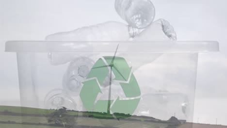 animación de un cartel de reciclaje verde sobre una caja con botellas de plástico y una turbina eólica