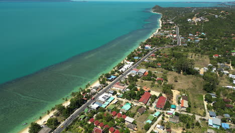 Aerial-parallax-around-Bang-Por-coast,-Koh-Samui-and-Phangan,-coastal-fringing-reef-and-sandy-beach