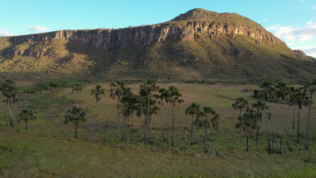 Maytrea Garden and Morro da Baleia, panoramic aerial drone view Jardim de Maytrea, green fields, mountains, sunset, Chapada dos Veadeiros, Goiás, Alto Paraíso