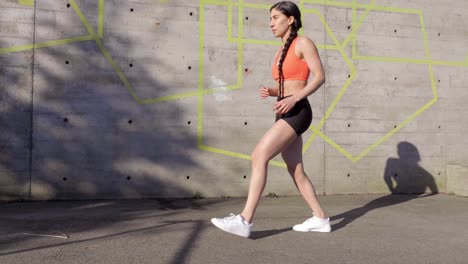 young athletic woman exercising lunges wide slow motion shot