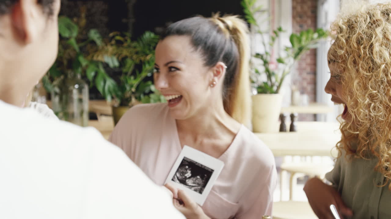 Pregant woman showing baby photograph ulrta sound scan