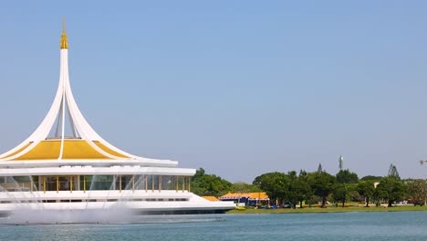 scenic view of pavilion and pond in park