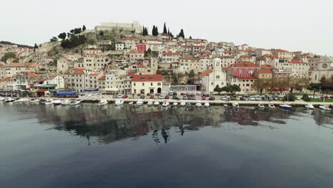 flying over the city of sibenik, panoramic view of the old town center and coast