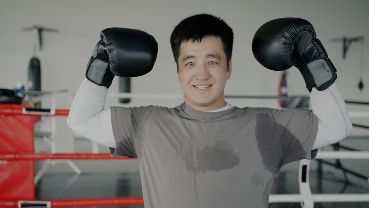 Man celebrating boxing victory