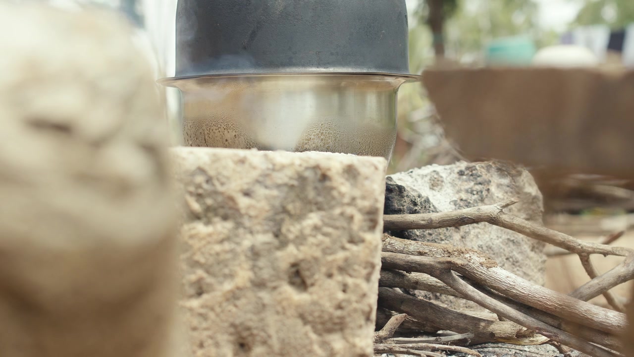 African Traditional Cooking on traditional outdoor Cooker