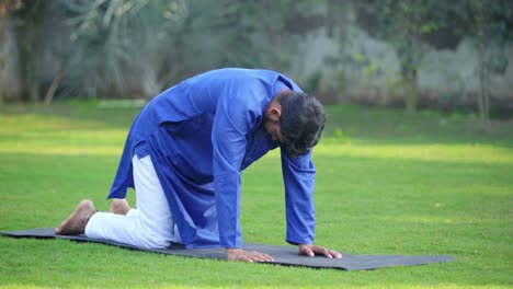 Indian-man-doing-cat-and-cow-yoga-pose