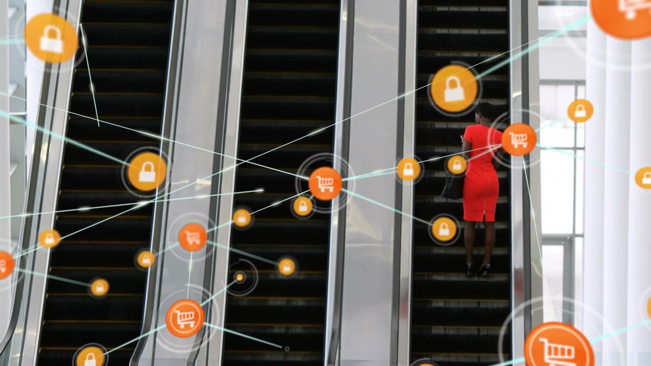 Animation of network of digital icons over rear view of businesswoman on escalator at modern office