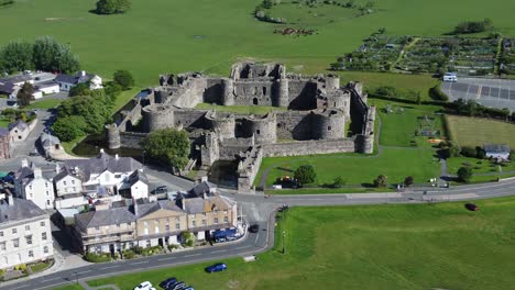 sunny touristic beaumaris castle town aerial view ancient anglesey fortress landmark zoom in fast