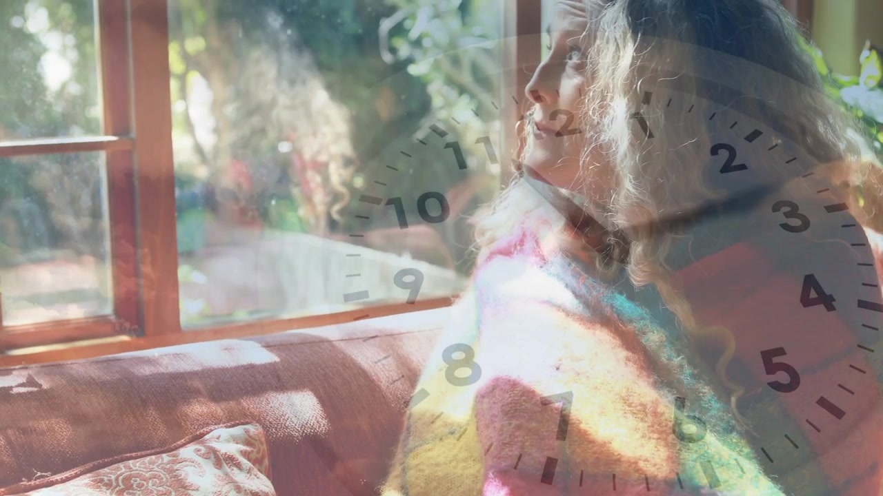 Frames showing mature woman adjusting blanket turning to window while clock overlay moving for home