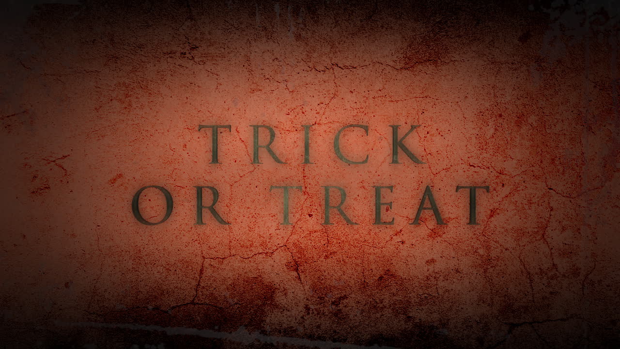 Trick Or Treat on dark orange grunge wall