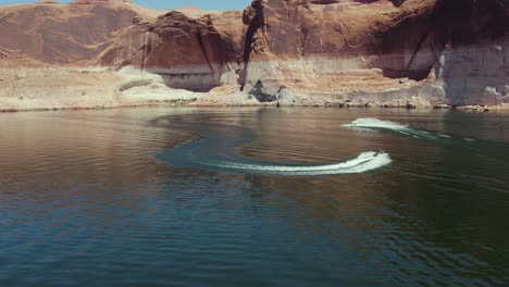 breathtaking aerial view of waverunner jet ski's in lake powell canyon