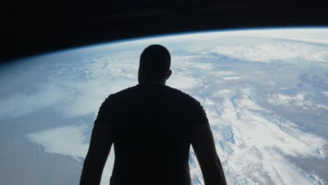 man looking at earth from space