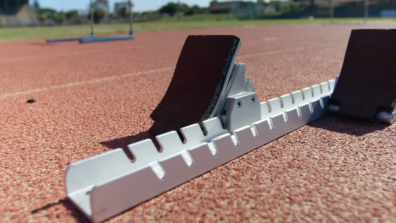 Close-up of starting blocks on a running track 4k