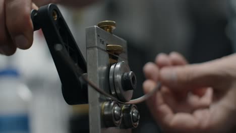 close-up of metal wire bending process