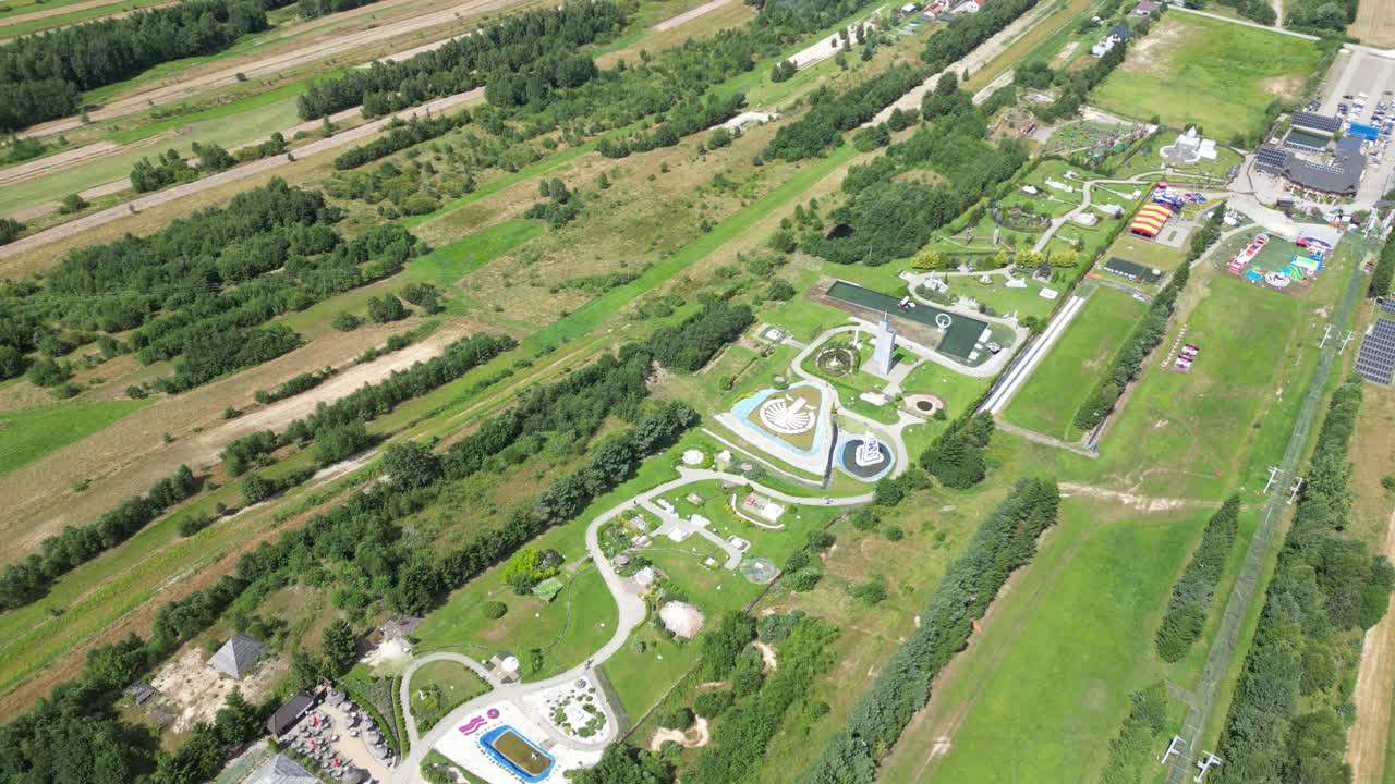 A captivating image showcasing a breathtaking sunset over calm waters, with the warm orange and pink hues casting a peaceful atmosphere over the serene landscape. The horizon is dotted with