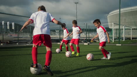 young soccer players practicing