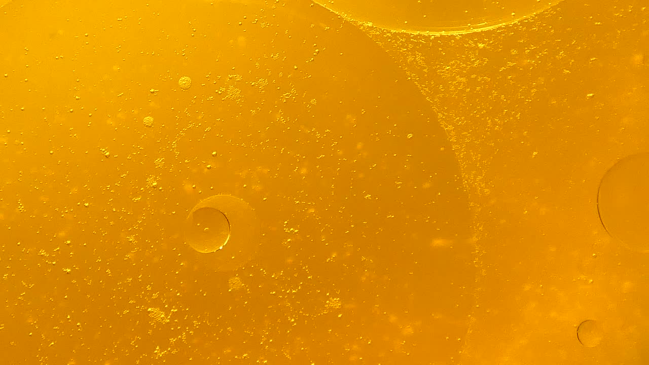 Sfondo con bolle d'olio d'oro rotanti.