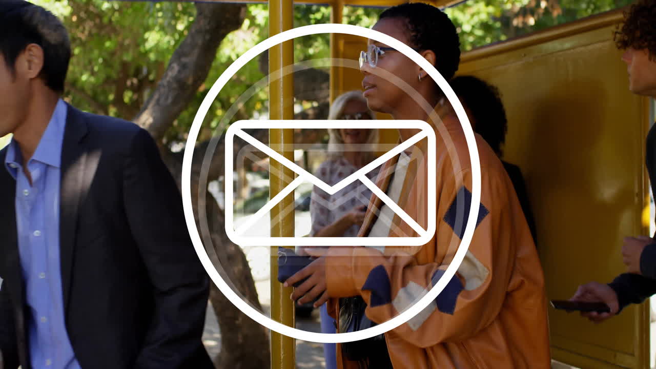 Waiting at bus stop, people with email animation overlay in urban setting