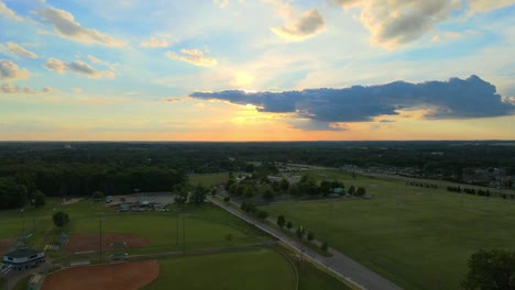 flyover of heritage park sports complex during sunset