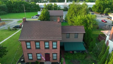 Rising-shot-of-old-brick-home-in-suburb