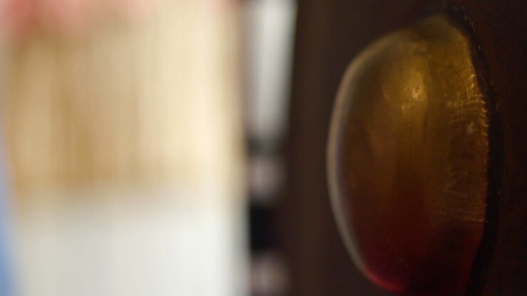 Mallet hitting traditional giant south east Asian gong, filmed as extreme close up