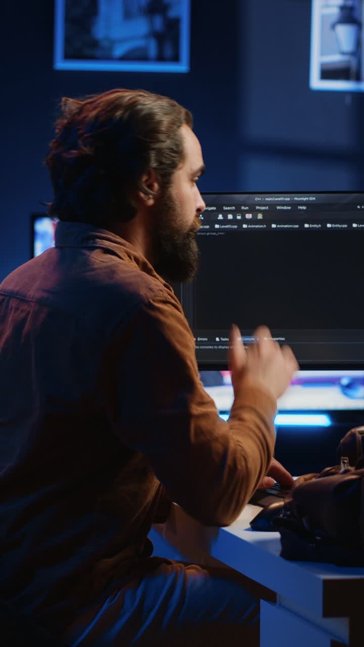 Focused Developer Typing Code on Computer at Night
