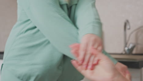 hands of two girls meet in playful gesture during lighthearted moment in kitchen, capturing emotional connection and joy of friendship through expressive movement and interaction
