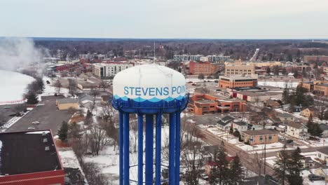 aerial, stevens point water tower in wisconsin during winter season