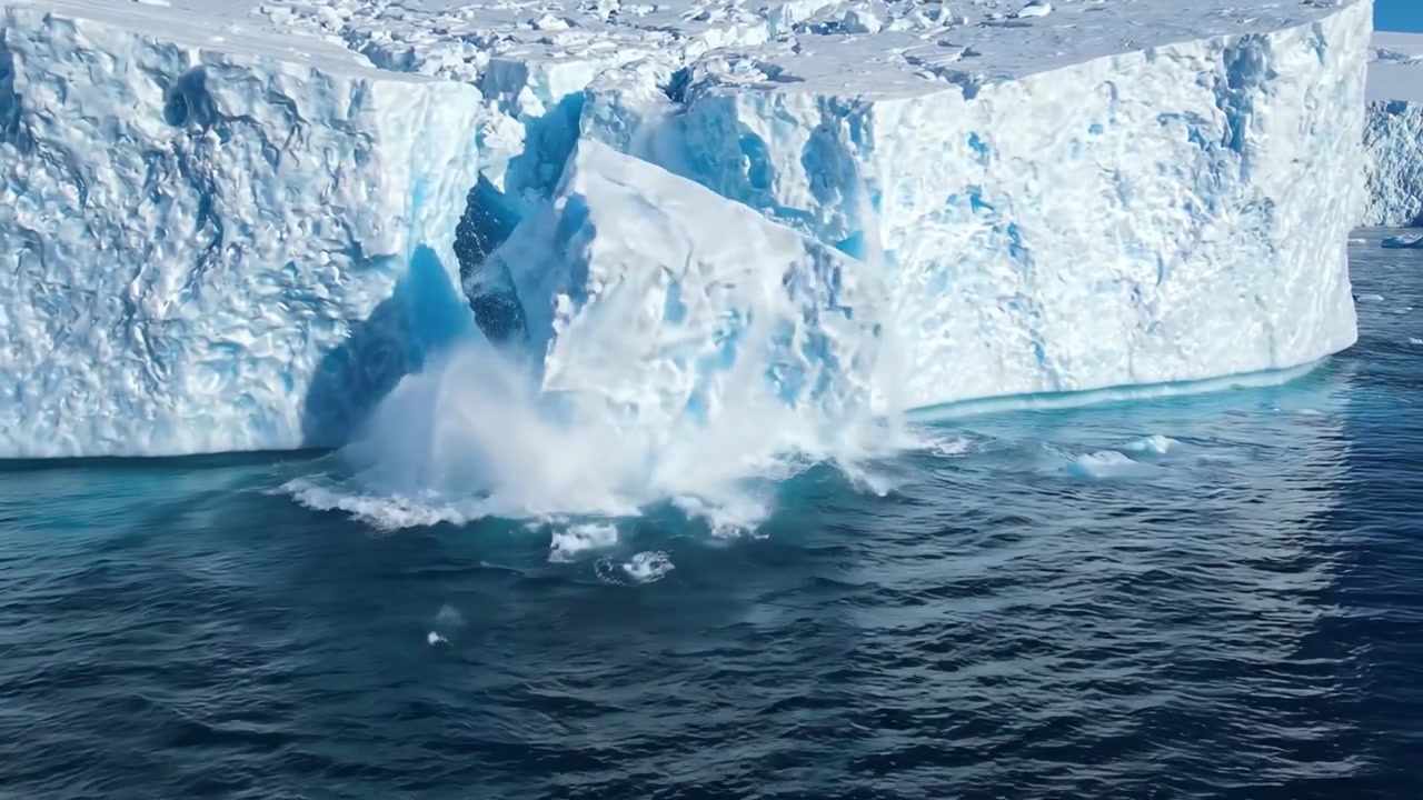 Majestic Iceberg Fragmentation: Observing the Impressive Breakage and Melting of Massive Ice Formations in a Serene Arctic Ocean Landscape