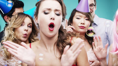 Multi-racial-group-of-happy-people-dancing-with-bubbles-slow-motion-party-photo-booth