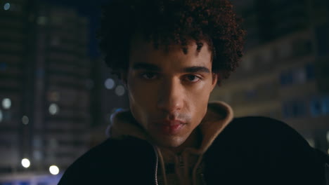 closeup thoughtful man urban lights late evening closeup. handsome youngster
