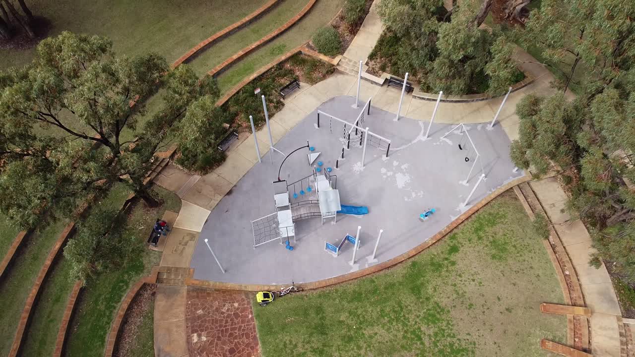 Aerial Ascending View Over Round Playground, Las Ramblas Park, Clarkson, Perth