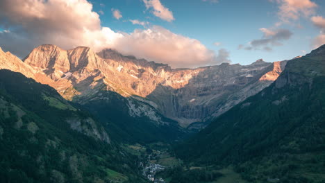 timelapse of sunset in gavarnie valley, the little town of gavarnie as foreground and the big waterfall as background