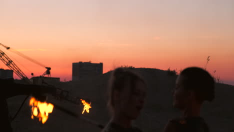 a man with a flamethrower at sunset in slow motion. costume for zombie apocalypse and halloween