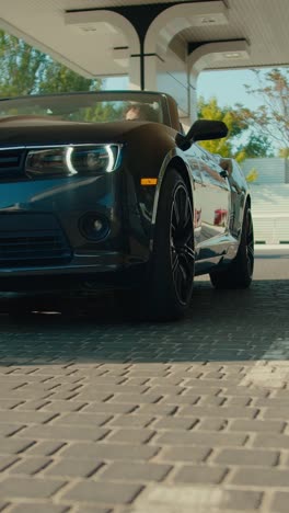 black convertible car under a canopy