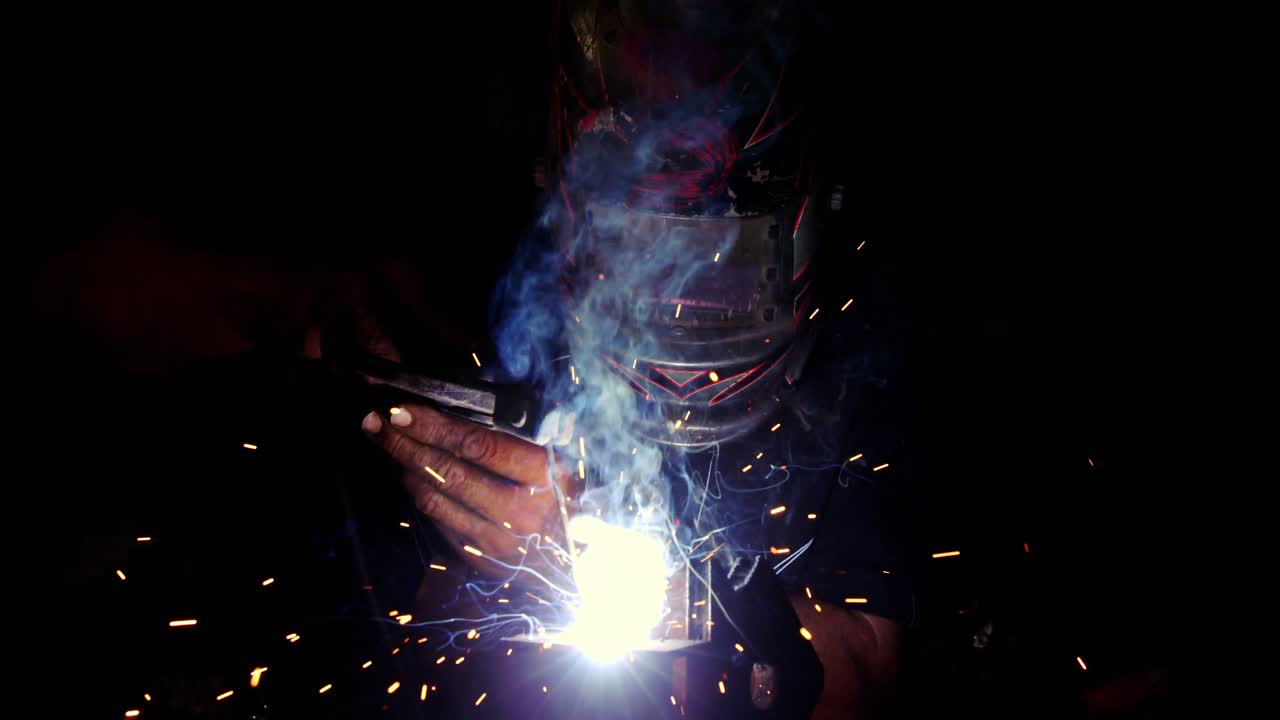Welder working on a piece of metal