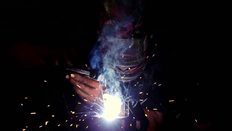 Welder-working-on-a-piece-of-metal