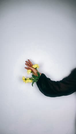 woman's arm with yellow flowers